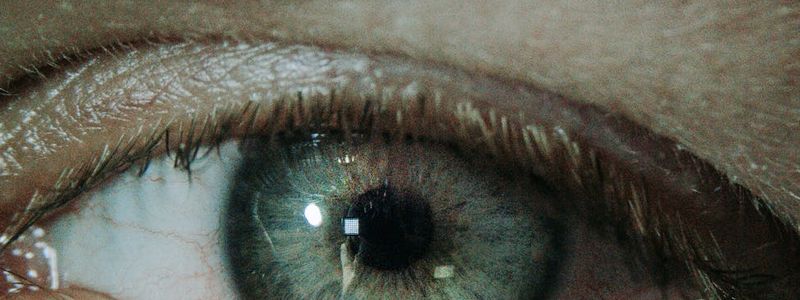 Macro shot of a clear calm human eye reflecting light